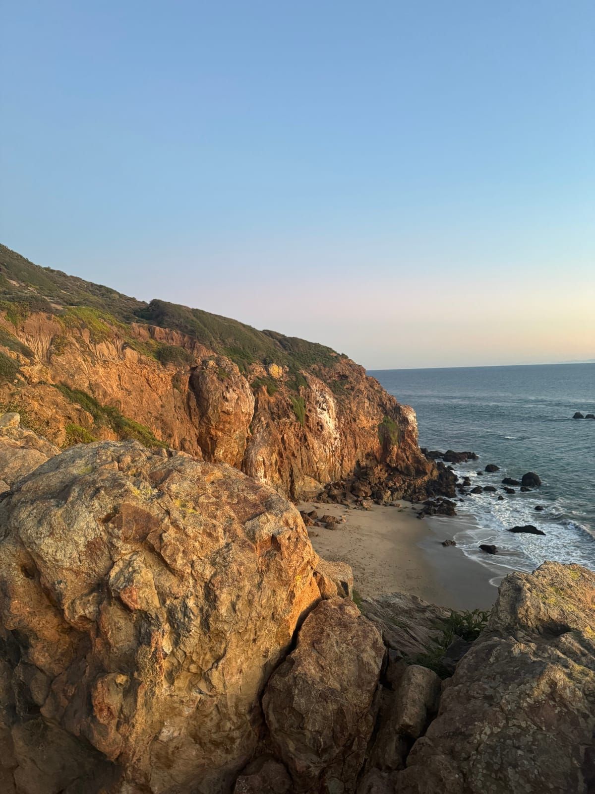 Sunset over cliffs and ocean on the California coast